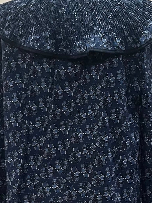 Blusa estampada con volante plisado
