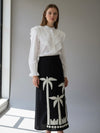 Look Palmira: Falda Negra con Palmeras