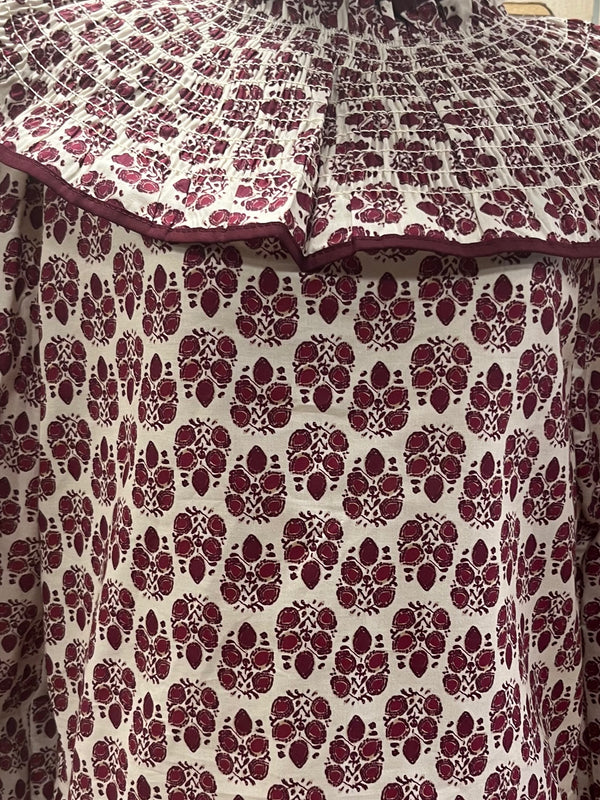 Blusa estampada con volante plisado