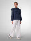Blusa estampada con volante plisado