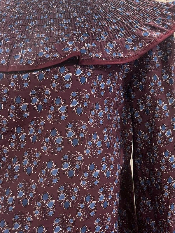 Blusa estampada con volante plisado