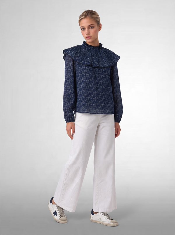 Blusa estampada con volante plisado