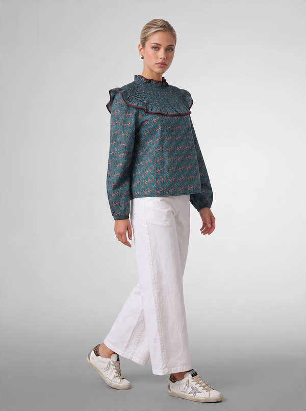 Blusa estampada con volante plisado
