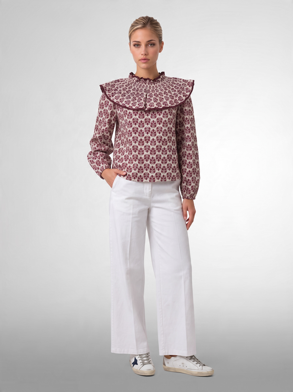 Blusa estampada con volante plisado